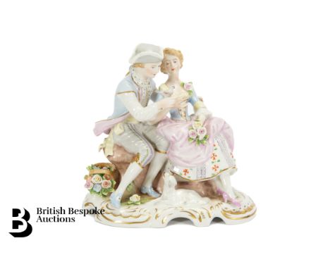 German porcelain figural group, young lovers seated on a bench, approx 18 x 19 cms, mark for Rudolf Kammer.&nbsp;
