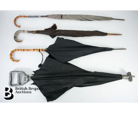 Four vintage umbrellas in good condition.