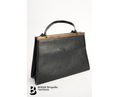 A vintage Asprey handbag, black leather, circa 1960s, with twin handles, sterling silver hardware with brass clip, London hal