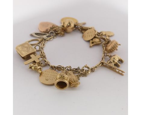 A 9ct yellow gold Charm Bracelet, with bolt ring clasp, suspended with a Victorian half sovereign, dated 1893, 19 various 9ct