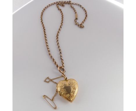 An Edwardian 15ct gold heart shaped Pendant Locket, hallmarked Chester, 1908, the front with foliate decoration and vacant ce