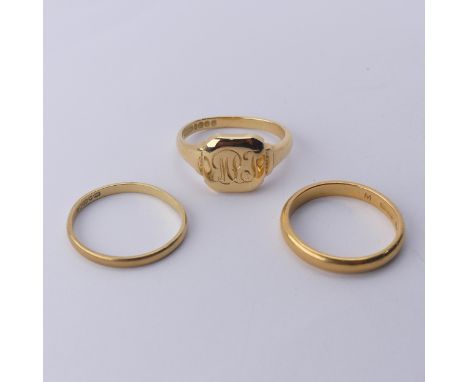 A narrow 22ct yellow gold Band, Size Q, 4.2g together with an 18ct gold signet ring, engraved with initials and a narrow 18ct