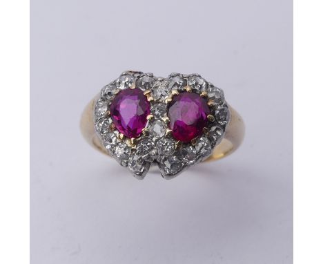 A late Victorian ruby and diamond cluster Ring,&nbsp;formed as two entwined hearts, central pear shaped rubies, approx. 5.6mm