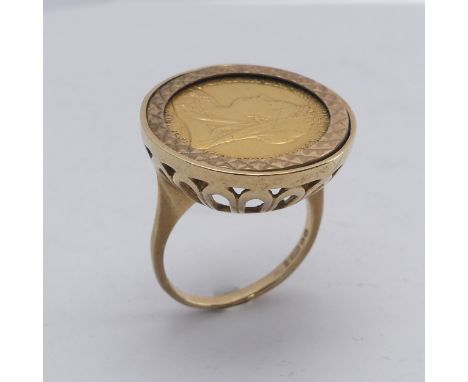 A Victorian gold Half Sovereign, date obscured by 9ct gold ring mount, Size L, total weight 8.7g. 