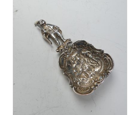 An Edwardian silver Caddy Spoon, by James Dudley, hallmarked London, 1906, the bowl with figural scene and with a cast figura