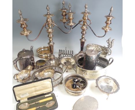A pair of silver plated three light Candelabra, circular bases with knopped stems and scrolling arms, 43cm high, together wit