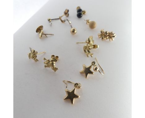 A quantity of small 9ct gold Ear Studs, together with two 9ct gold St. Christopher pendants, a small 9ct gold ring and damage