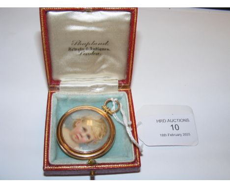 A yellow metal pendant locket with hand painted portrait miniature of a child to the front and lock of hair to the reverse 
