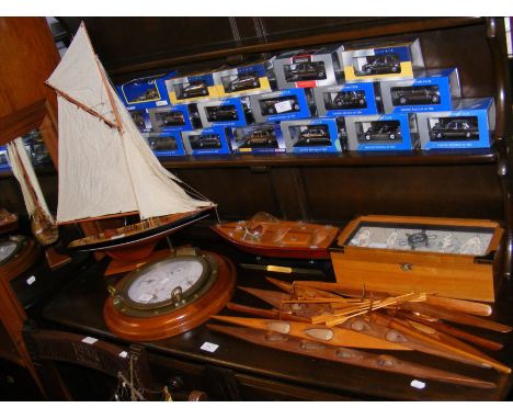Wooden canoe, sailboat and motorboat models, together with a wall barometer and nautical knot box CONDITION REPORT.