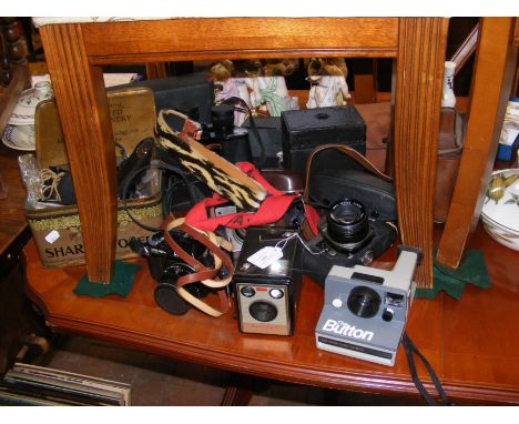 Vintage optical equipment, including binoculars and Kodak Brownie Flash III Camera 