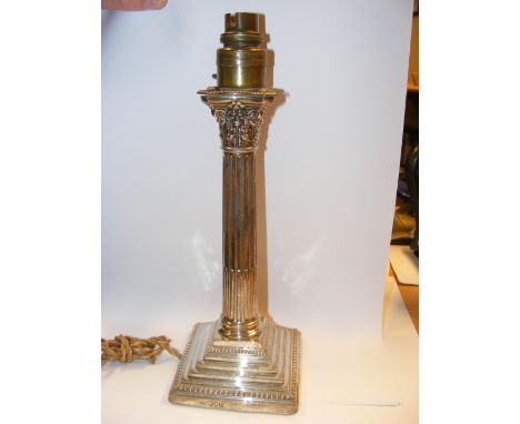 A weighted silver Corinthian column candlestick converted to table lamp CONDITION REPORT In our judgement, overall condition 