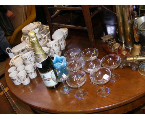 Eight vintage Babycham coupe glasses, together with unopened Babycham Sparking Perry and blue glass jug