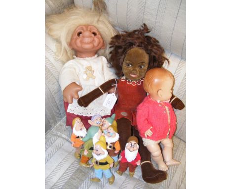 A vintage 1984 Dam troll, together with the dwarves from Snow White and the Seven Dwarves and other dolls