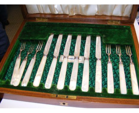 A cased set of six Victorian silver fruit knives and fork with mother of pearl handles in original fitted presentation case b