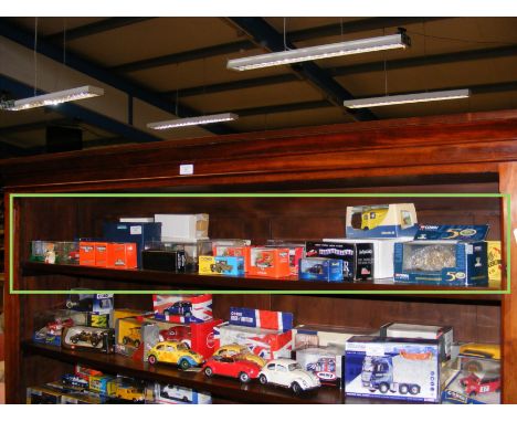 Various boxed die cast toys, contained on one shelf
