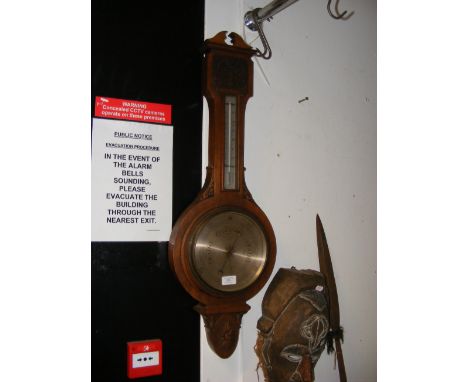 An Aitchison & Co. of London wall barometer/thermometer in carved case