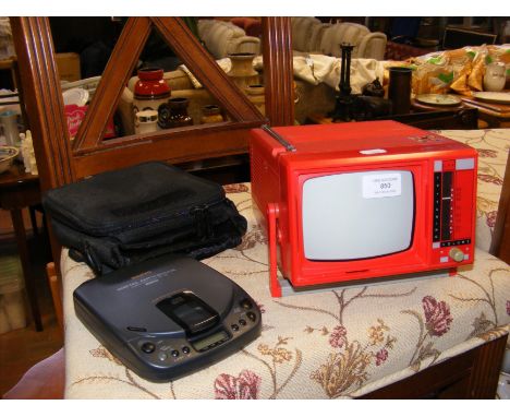 A vintage Boots MTV 5 tabletop tube TV, together with Sanyo portable compact disc player 