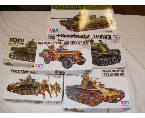 Six Tamiya model kit tanks and other Army vehicles