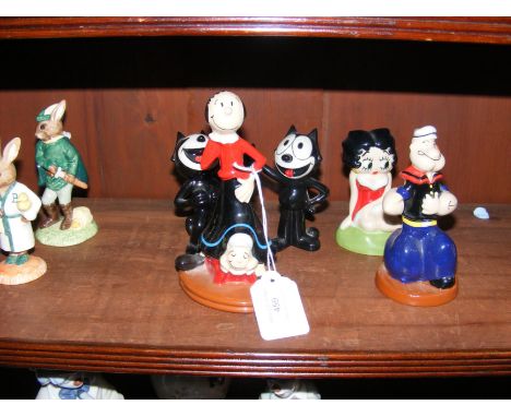 A Wade collectable figure 'Olive Oyl' and 'Popeye', together with three others