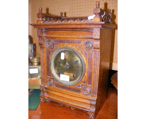 An oak cased mantel clock - 38cm high