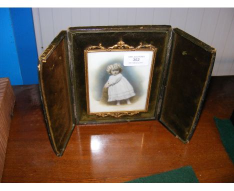 A photographic portrait in decorative gilt frame and travelling case - 17cm x 15cm