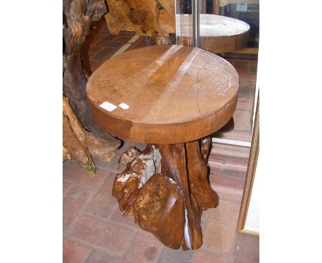 A driftwood occasional table with tree trunk round top - diameter 39cm 