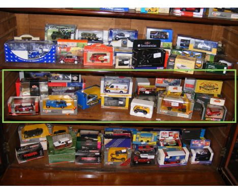Die cast model vehicles including Matchbox and Corgi - on one shelf