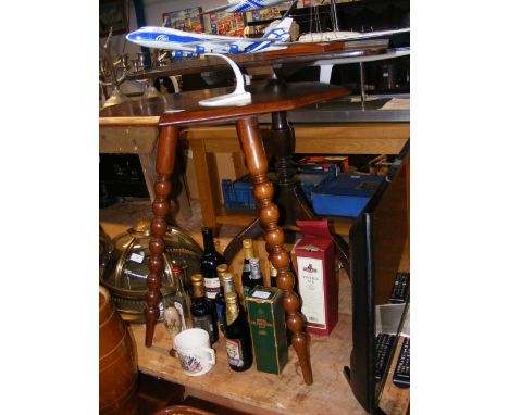 An octagonal occasional table on bobbin supports, together with one other table 