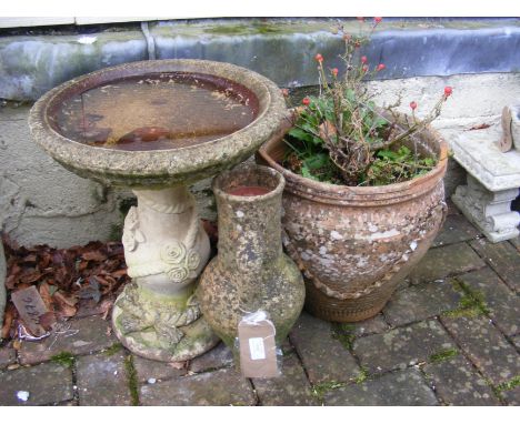 A bird bath, terracotta pot and a amphora vase