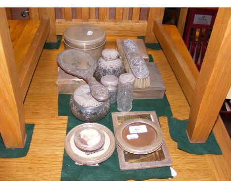 A quantity of silver and white metal trinket boxes, dressing items and photo frames 