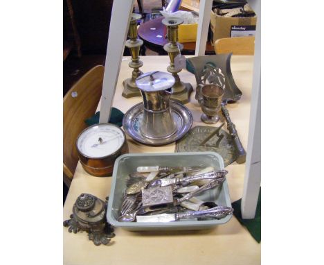 A vintage aneroid barometer, pair of brass candlesticks, white metal matchbox cover and other metalware