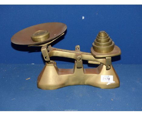 A brass weighing scales.