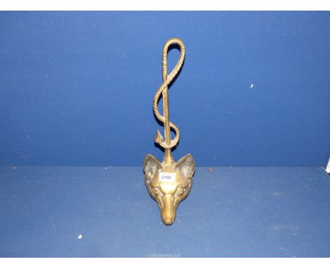 A Brass Doorstop in the form of a whip and fox head.