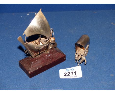 A miniature model of a wagon, mule and cowboy marked 900 silver, plus an unmarked model of a small sailing boat on mount.