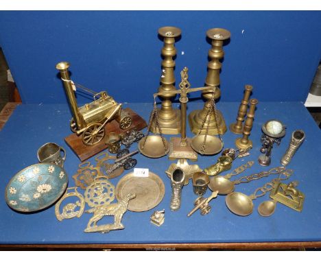 A box of brass and metals including; novelty pencil sharpeners, pair of candlesticks, a model of Stephenson's Rocket on plint