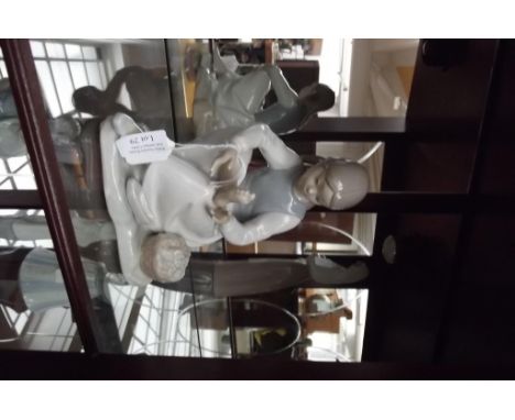 Nao figure of a seated girl