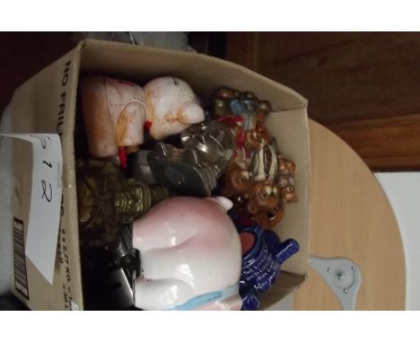 Large collection of money boxes, brass, ceramic etc  