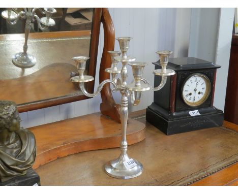 An alloy five arm candlestick