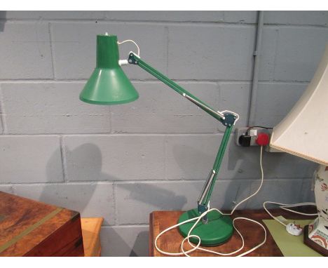 A green coloured anglepoise style lamp
