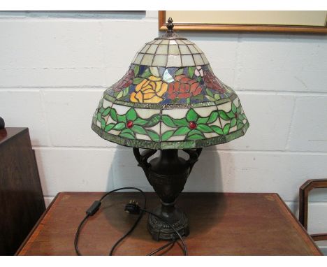 A modern Tiffany style table lamp of vase form