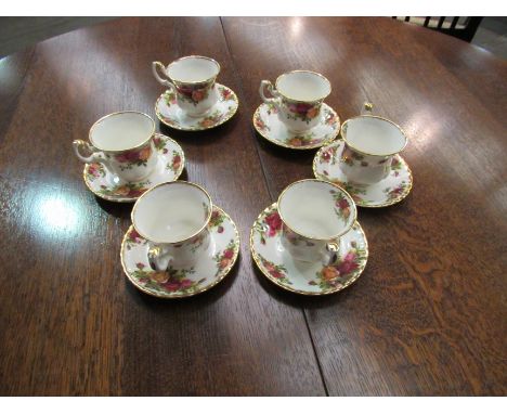 A set of six Royal Albert "Country Rose" tea cups and saucers