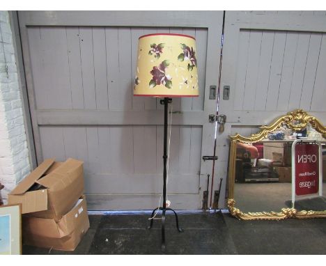 A modern cast iron electric standard lamp with shade