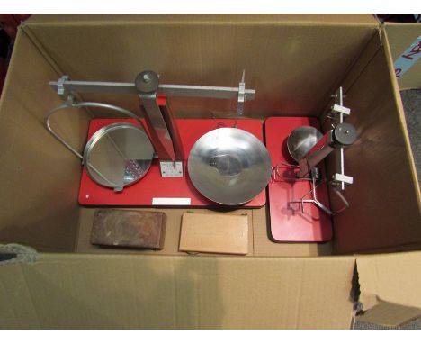 Two sets of Denward Manufacturing pharmacy scales with weights. Smaller set missing one dish