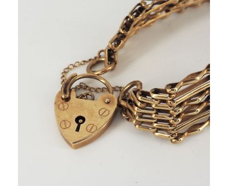A 9ct yellow gold 6 bar gate bracelet with safety chain + locket, Fully hallmarked 375, in great condition, approx weight 17.