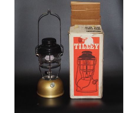 A vintage Tilly storm lamp, in original box, box is damged but lamp is in great condition