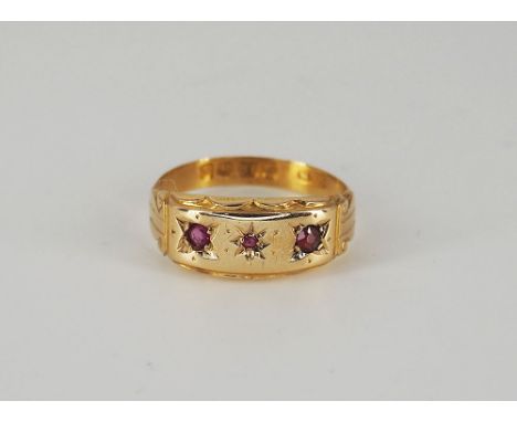 An 18ct yellow gold Victorian ring with ruby stones, approx weight 1.8 grams,. size L+1/2, in great condition