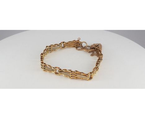 A 9ct yellow gold 4 bar fancy gate bracelet, clasp is a heart padlock that works perfect, in great condition, it is 7.5 inche