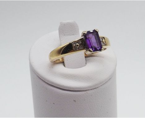 A 9ct yellow gold dress ring with Amethyst and Diamond stones, fully hallmarked 375, Amethyst stone is an emerald cut design 