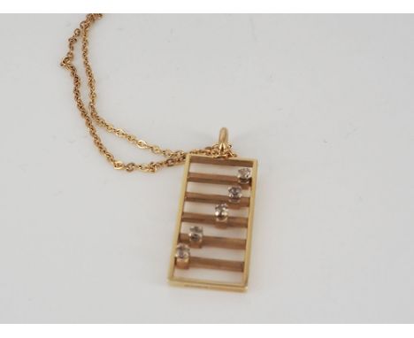 A 9ct yellow gold abacus hand made diamond set pendant, all diamonds move left to right on the pendant, chain is 18 inches in