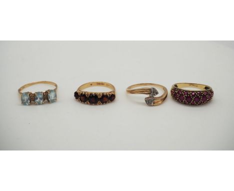 A mix of 9ct yellow rings, the diamond ring is a size O + 1/2, the garnett ring is size L+1/2, the aquamarine is a size O, th